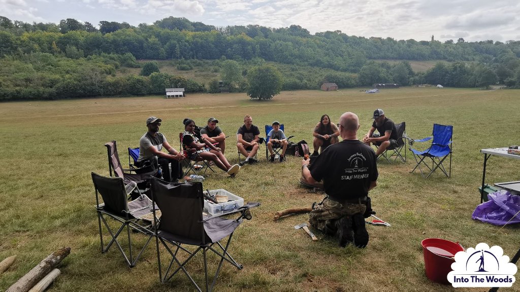 Wellness Days - group seated in circle outdoors in open field