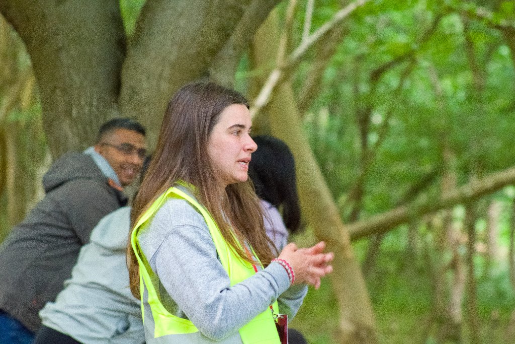 Into The Woods instructor engaging with participants in woodland