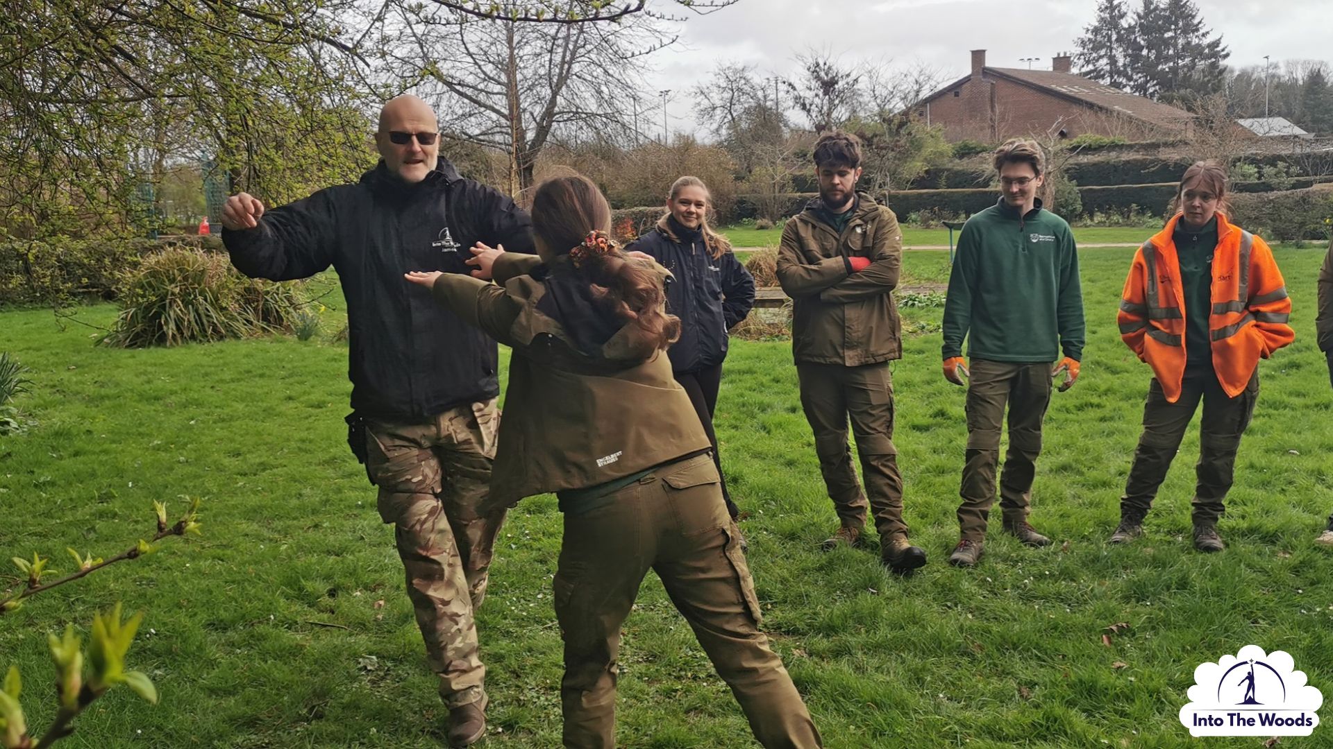 Empowerment Days team building Kent - corporate group working together in woodland