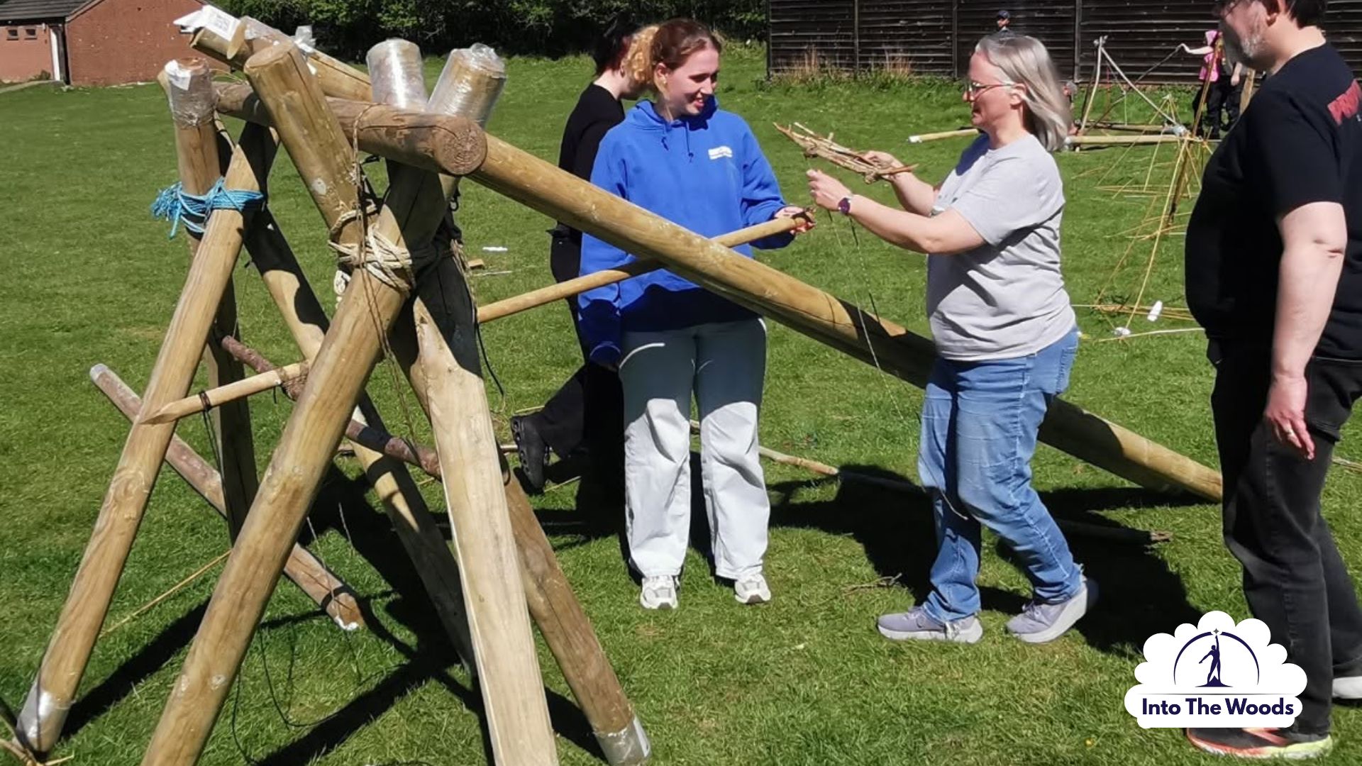 Siege Building team building Kent - corporate group working together in woodland