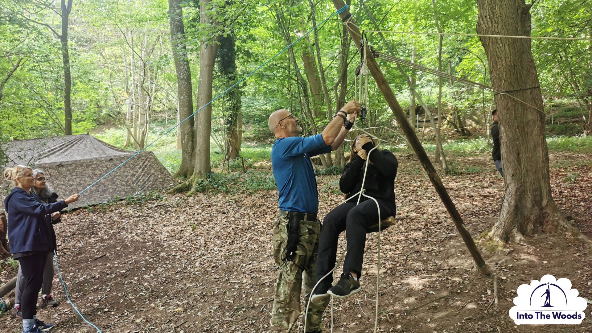 Large-Scale Pioneering Kent - participants enjoying the activity in woodland