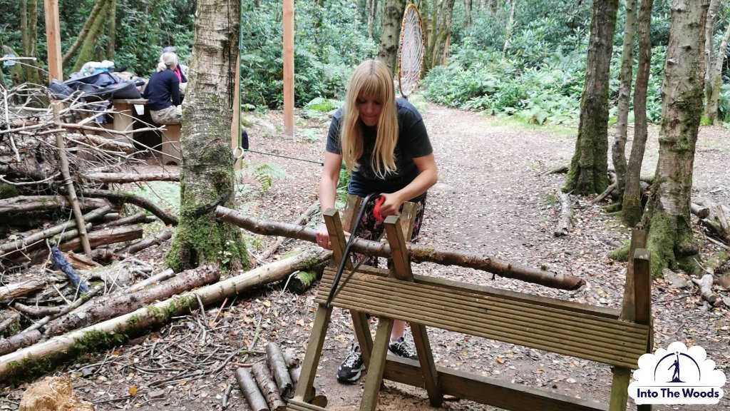 Tool Skills - sawing a log on a sawhorse in woodland