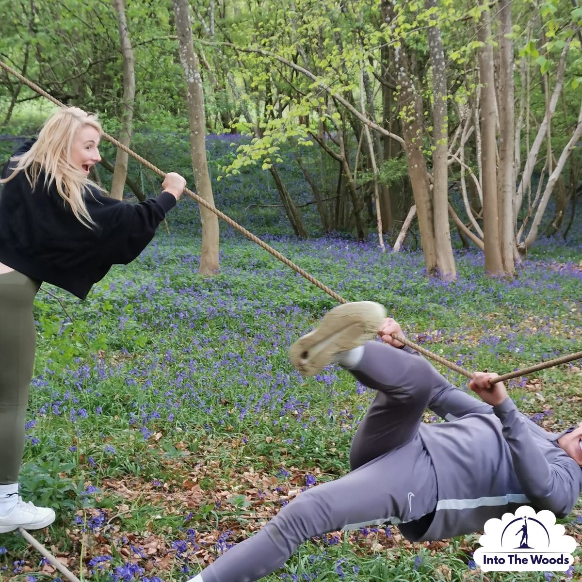 Team Building Kent - group completing woodland challenge around a tree
