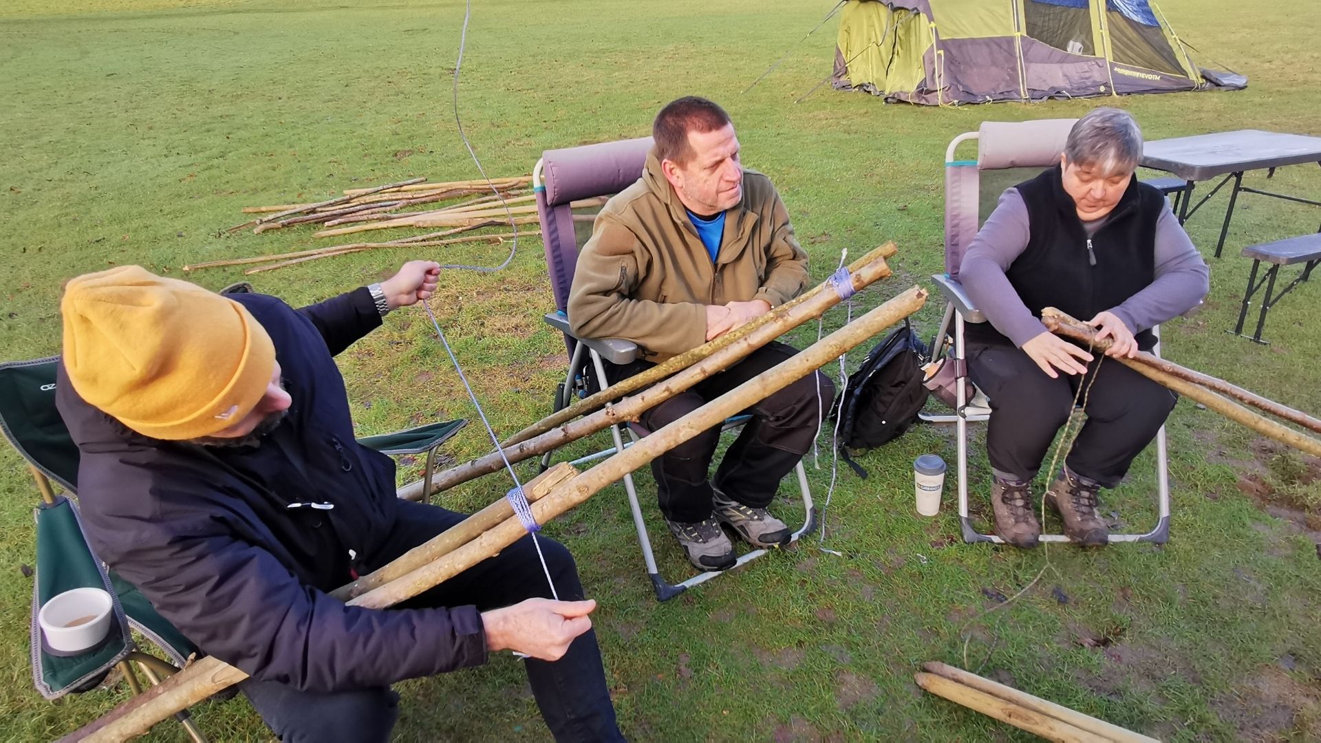 Group pioneering with logs and rope at an Into The Woods outdoor event near Orpington