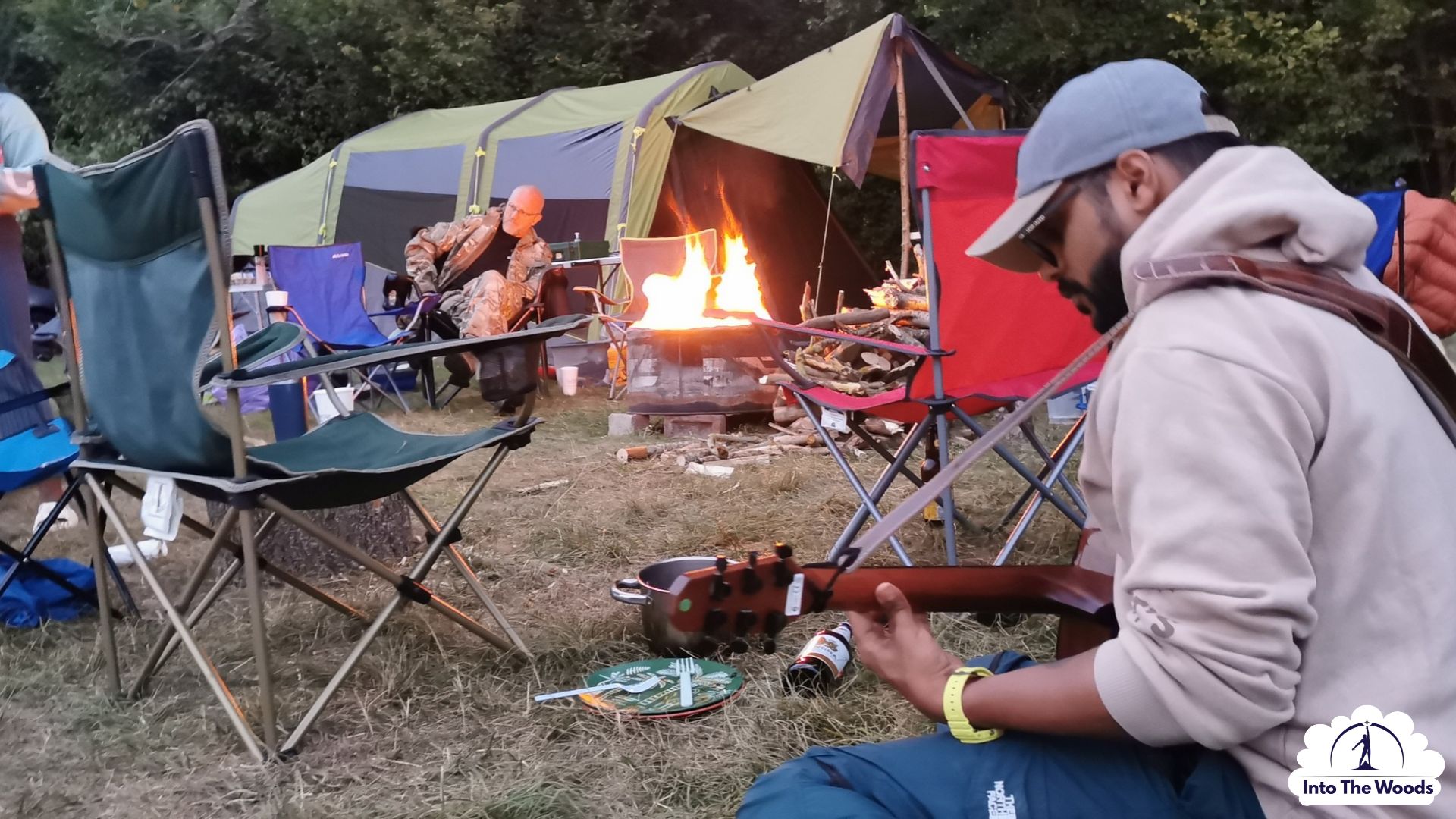 Poetry and Creative Writing Kent - guitar by the campfire at dusk