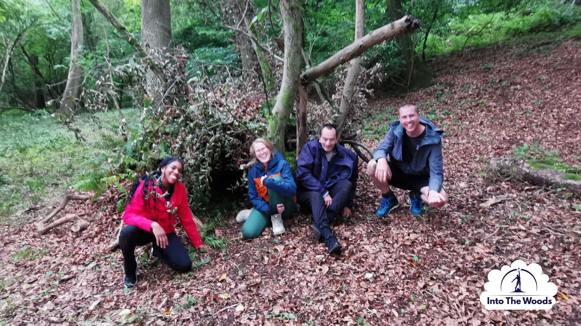 Shelter Building Kent - group constructing a debris shelter in woodland