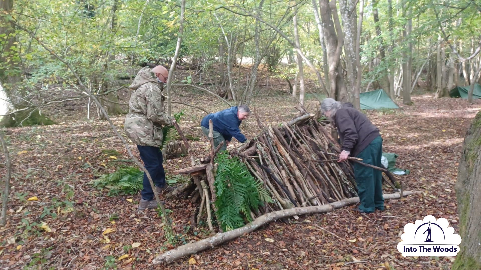 Shelter Building Kent - participants enjoying the activity in woodland