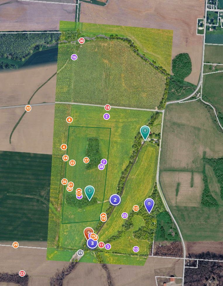 Aerial satellite map overlay with GPS-tagged wildlife sighting markers and boundary lines