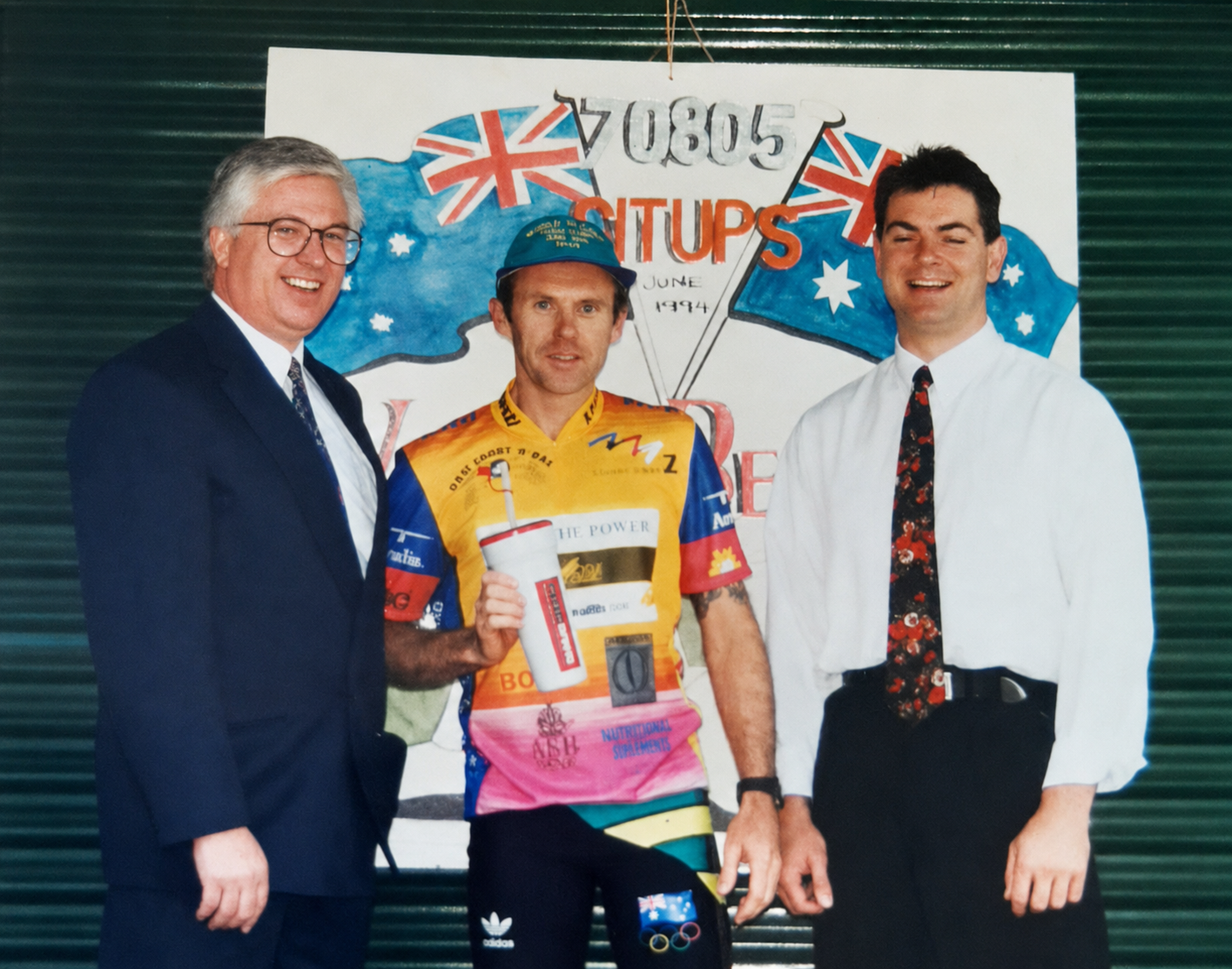 Kevin Odonoghue with sponsors in front of the 70,805 sit-ups world record sign