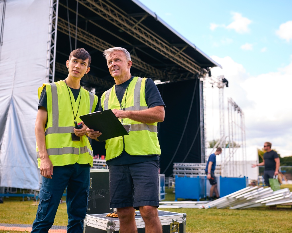 Production crew planning a large stage build