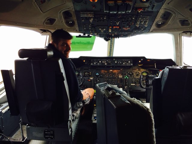 Gregory P. Smith in an aircraft cockpit