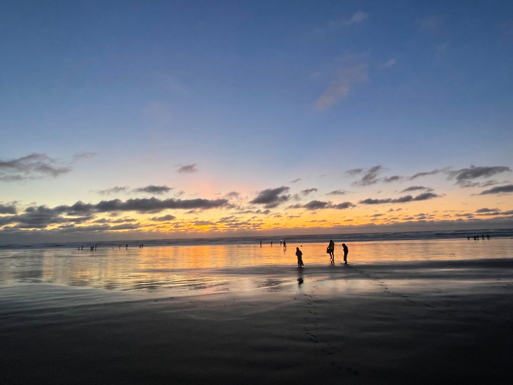 Sunset clam dig on a wide Pacific beach