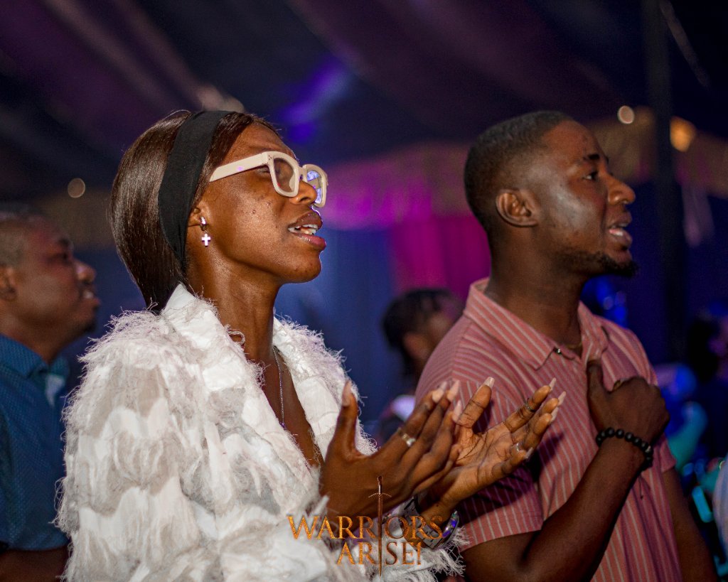 Warriors Arise 2024 — Worshippers responding in prayer at the altar