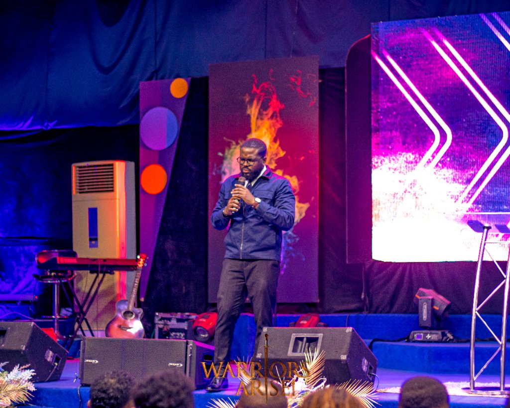 Warriors Arise 2024 — Speaker on stage during evening session