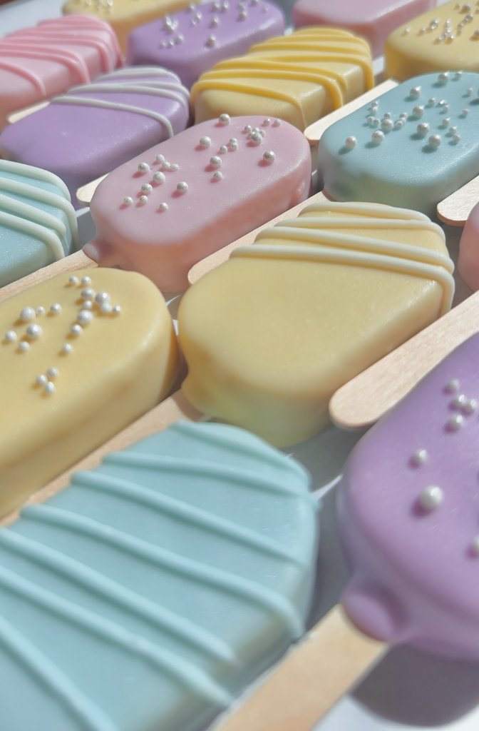 Artisanal cake pop cracked open revealing moist cake interior