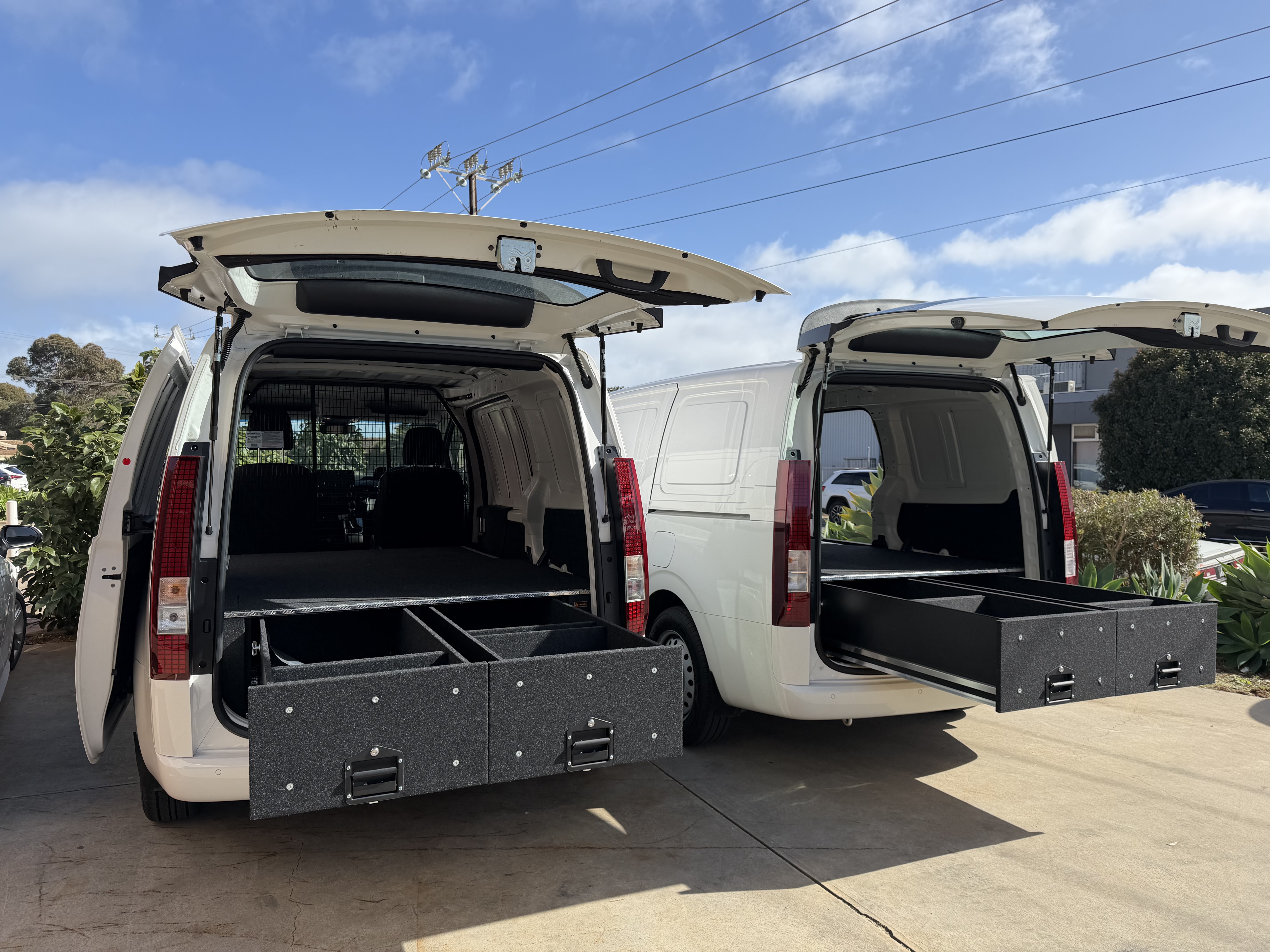 Two commercial vans with rear drawer storage systems