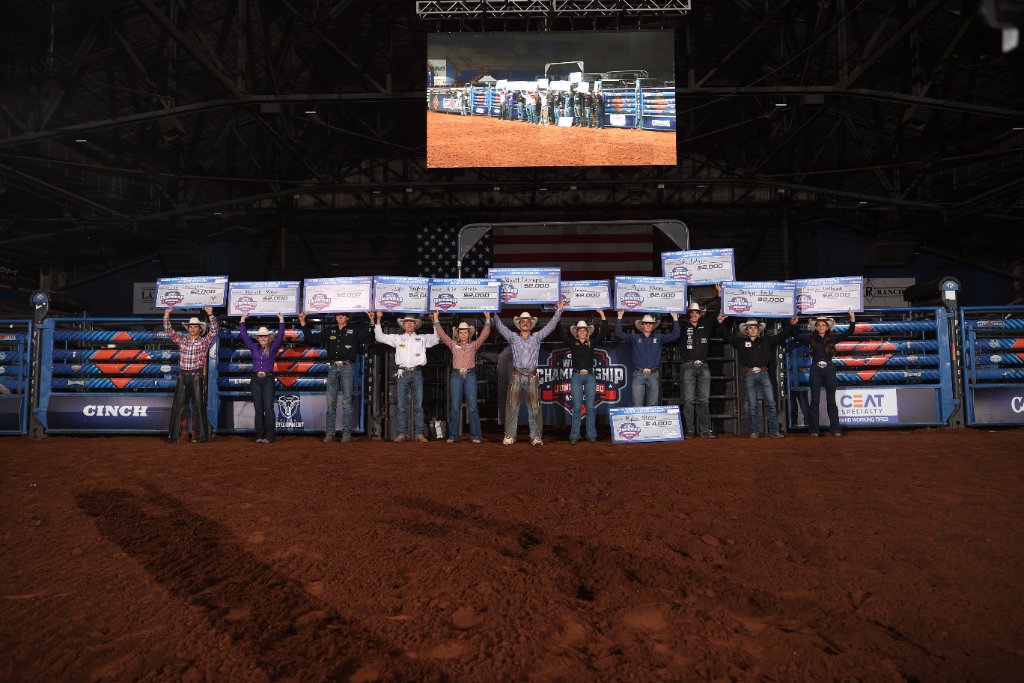 WCJR champions with prize checks at Lazy E Arena