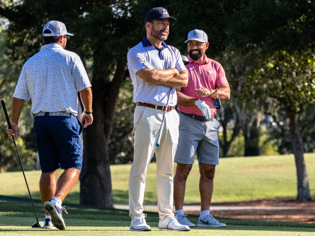Group of four golfers on a scenic fairway at TPC Sawgrass
