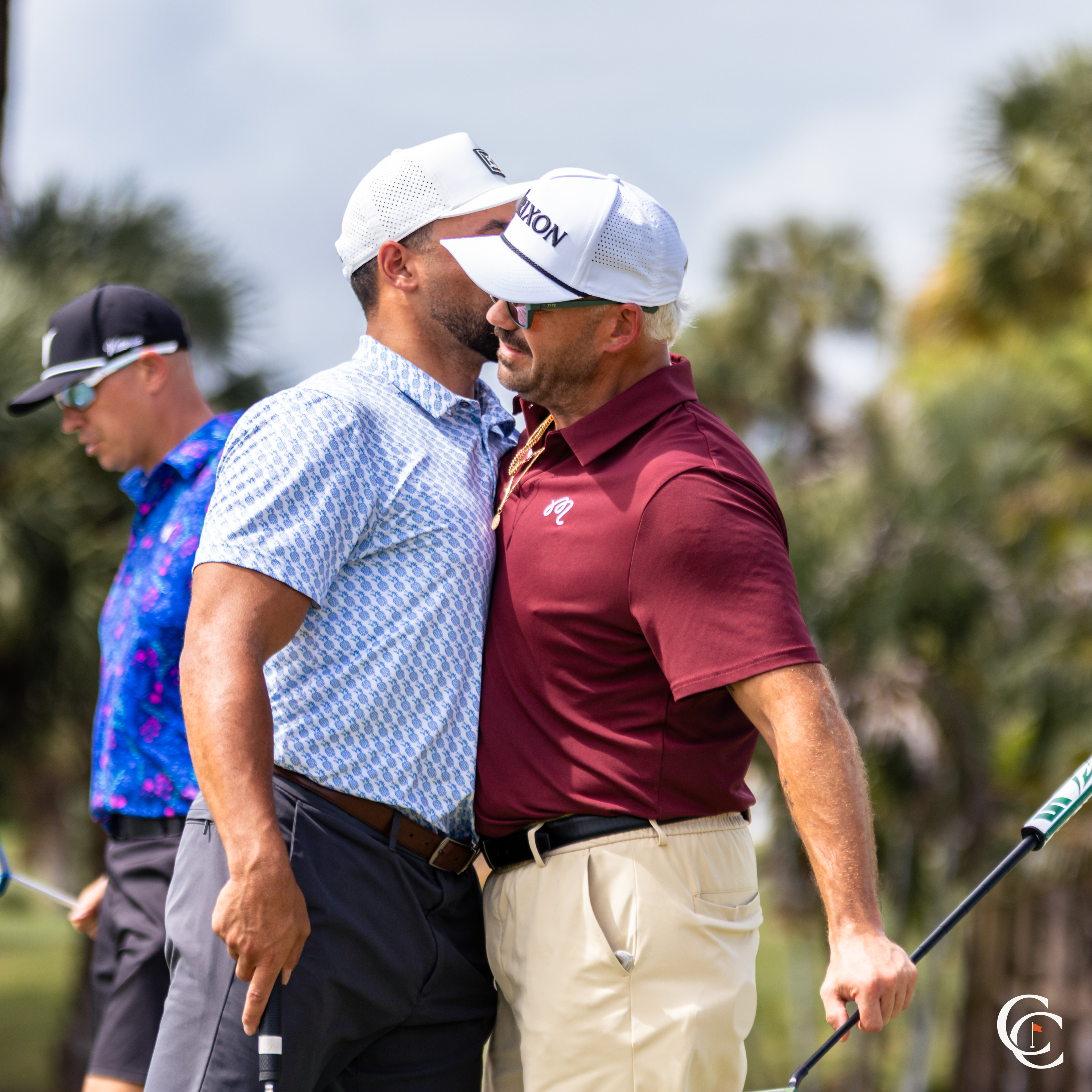 Two golfers sharing a moment on the course