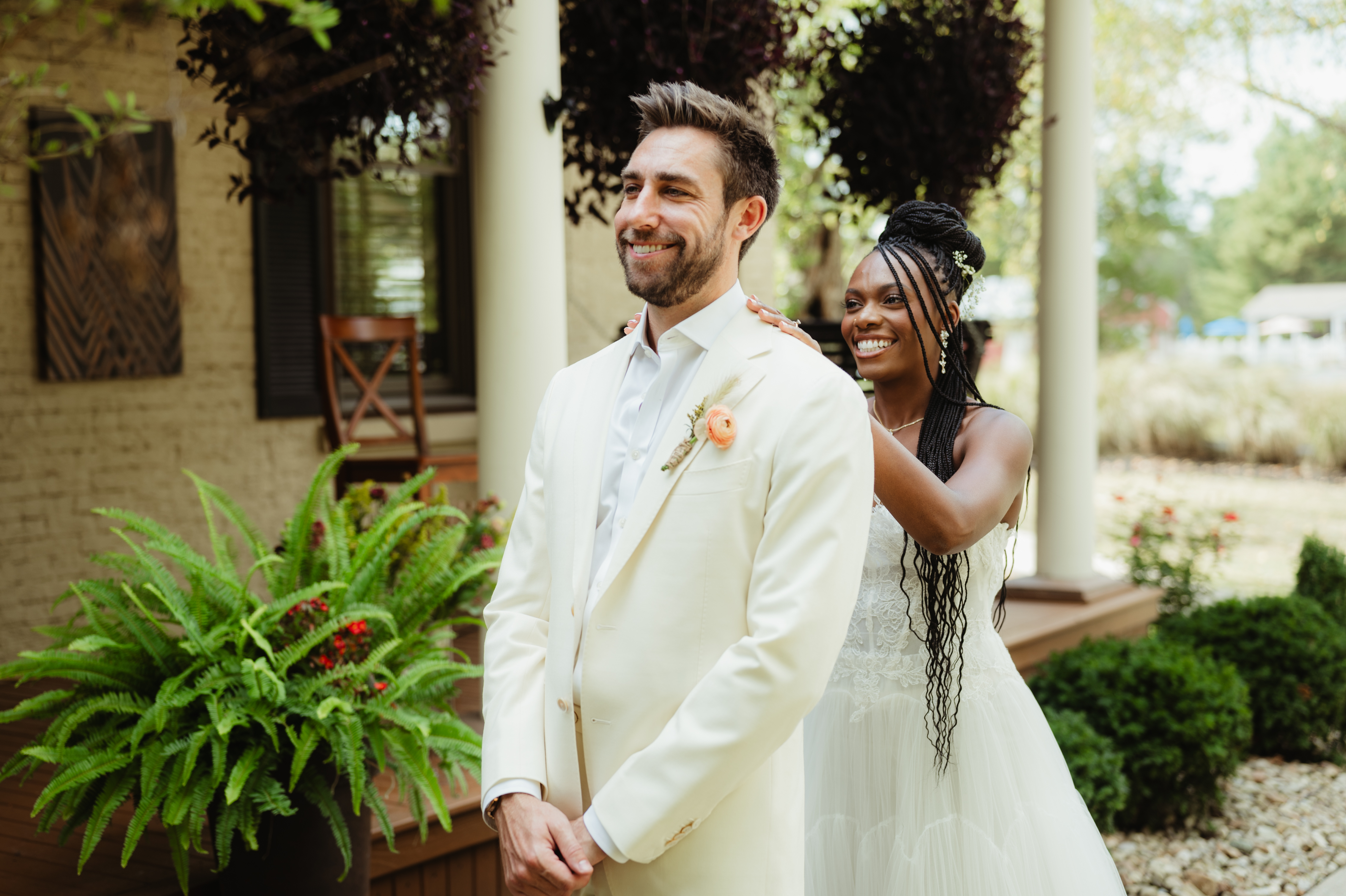 First look moment on a covered porch