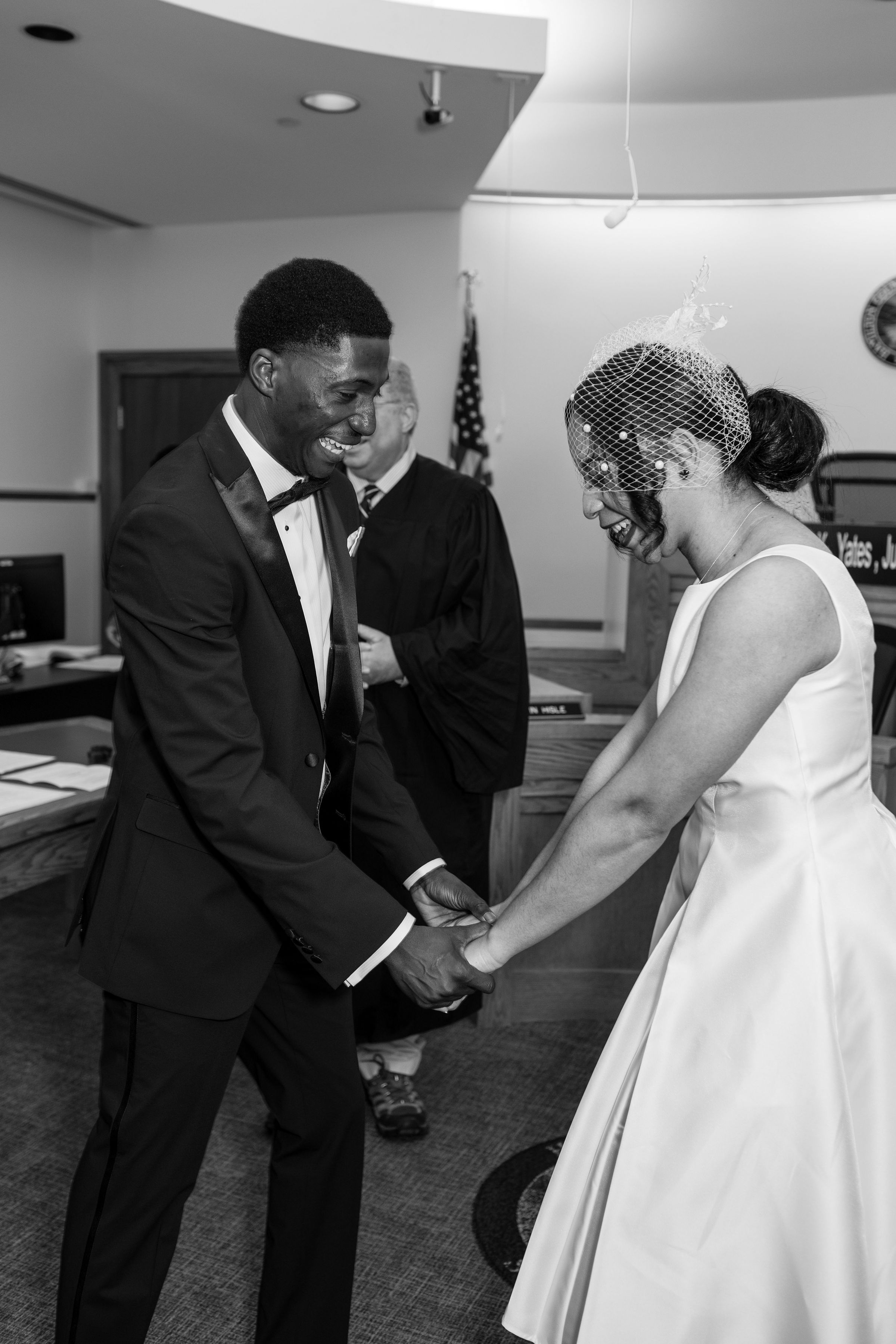 Couple laughing together on their wedding day