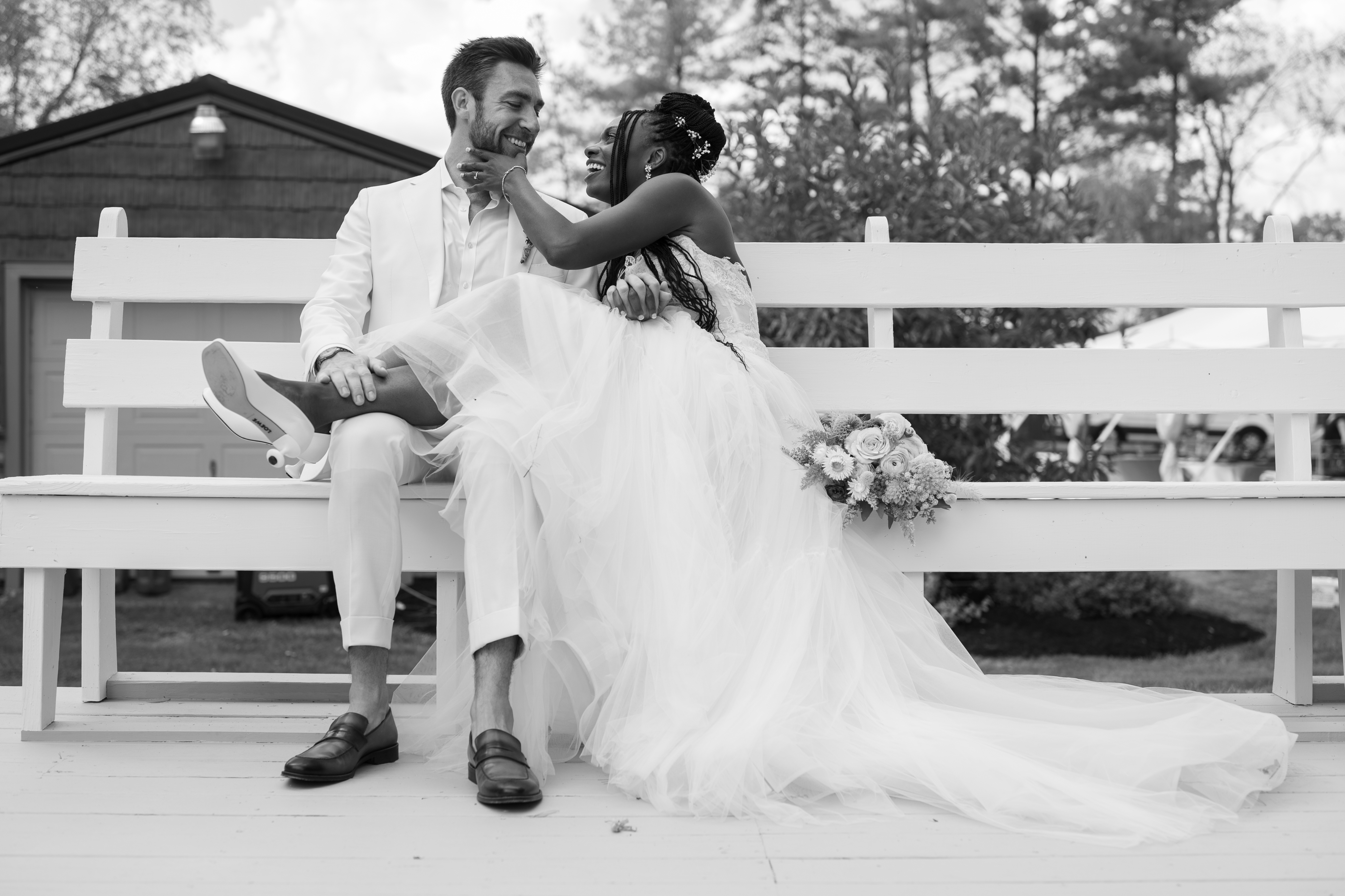 Couple sharing a moment on a white bench
