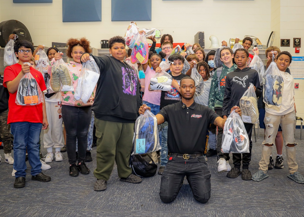 AduKicks 3rd Annual Shoe Drive — kids receiving shoes