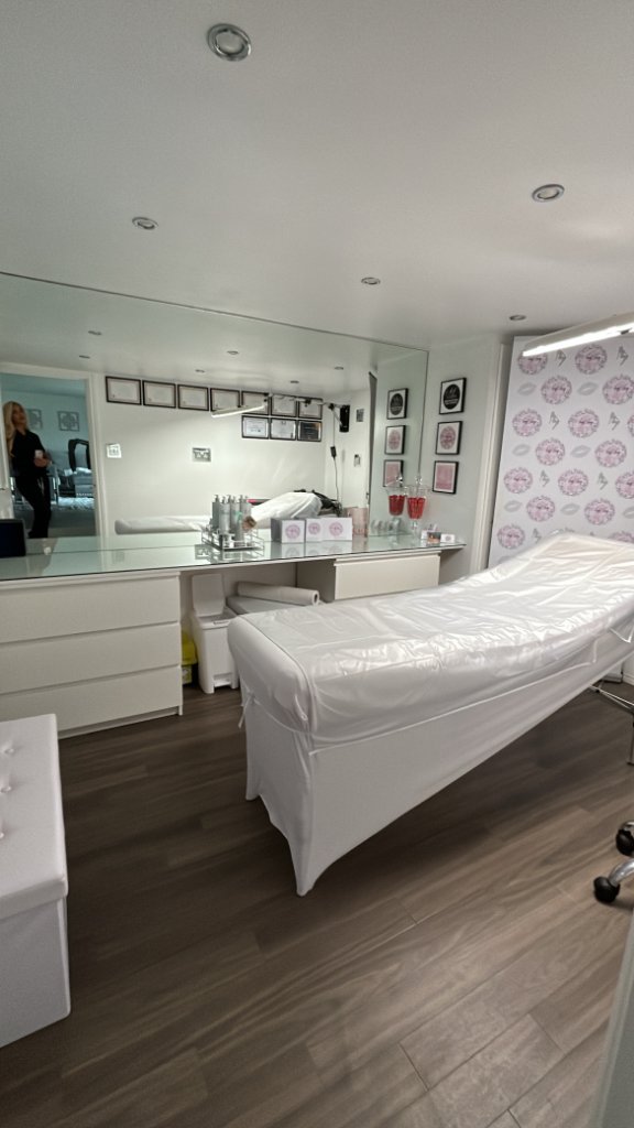 Treatment bed and vanity workstation
