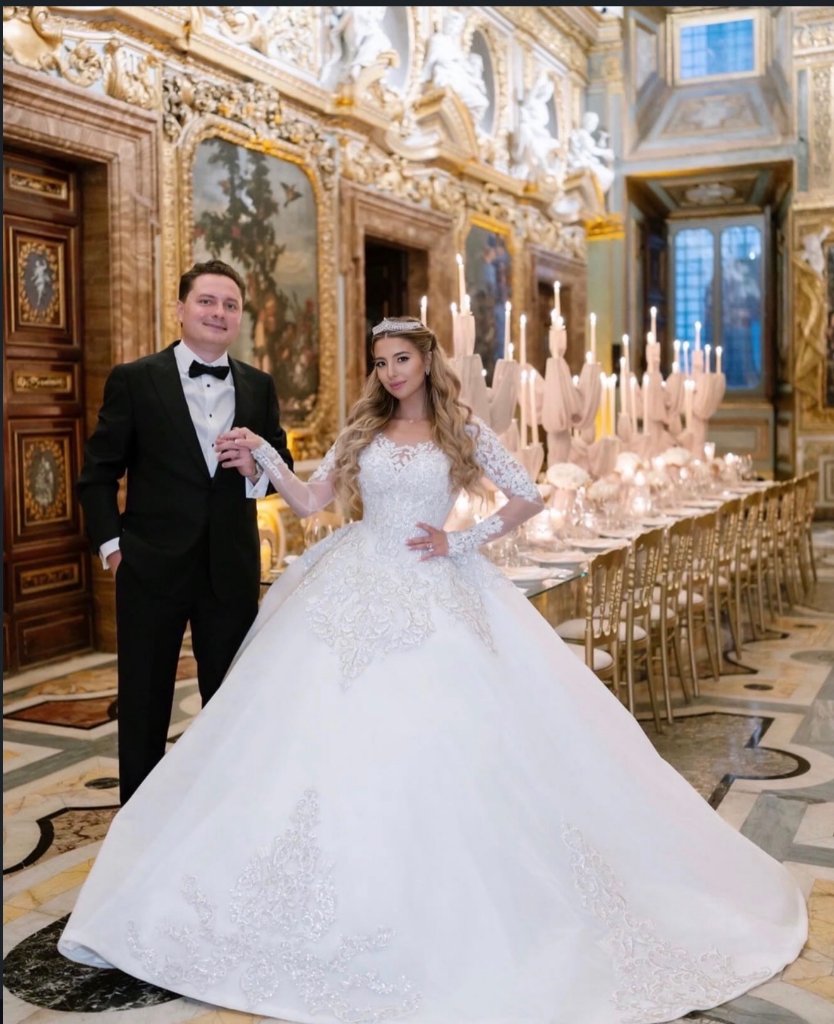Bride and groom in ornate Vatican ballroom, couture lace ball gown wedding dress with cathedral train, bridal alterations Boynton Beach