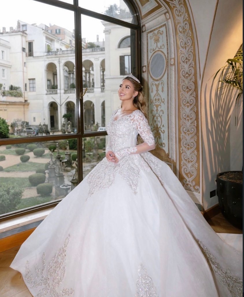Wedding dress fitting Boynton Beach, bride in stunning lace ball gown with cathedral train and tiara at Bridal and Couture Alterations