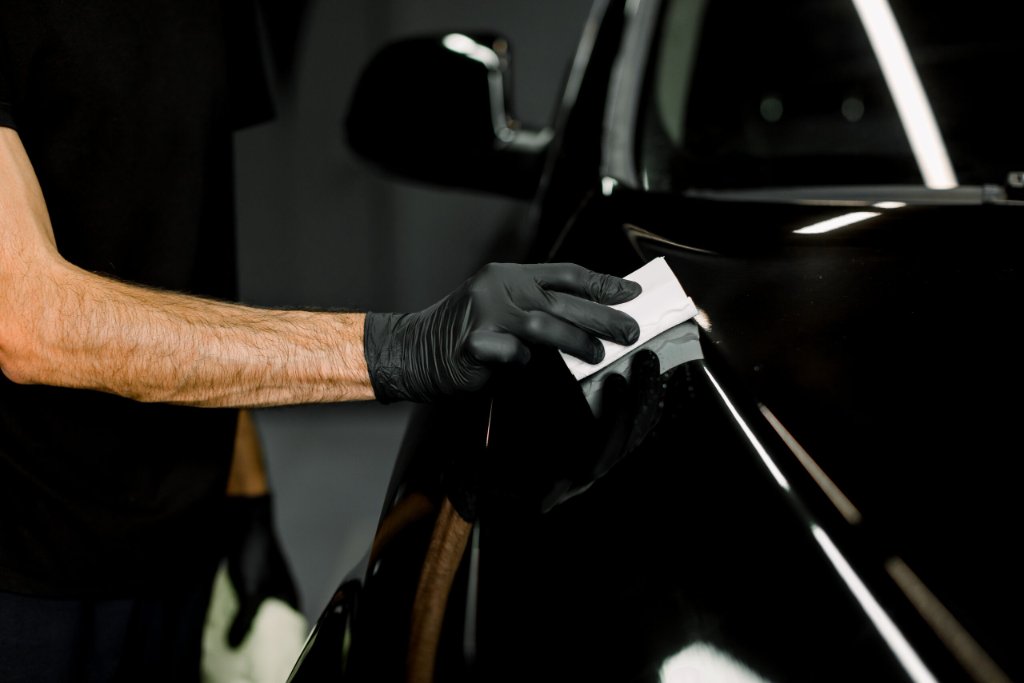 Technician applying ceramic coating
