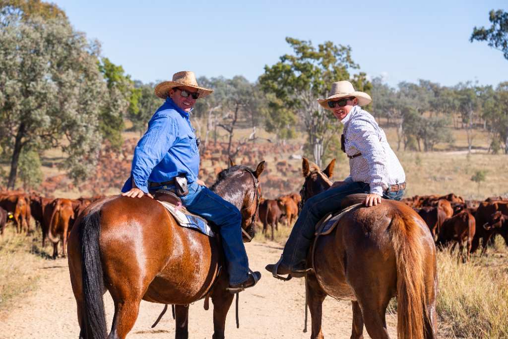 Station crew on horseback in the field