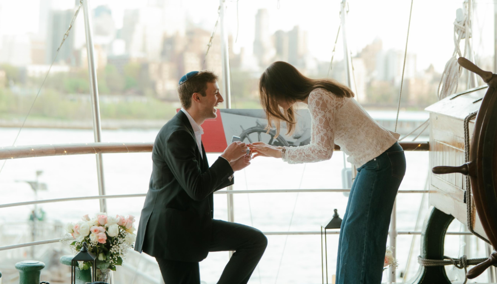 Eli proposing to Annael on a historic tall ship on the East River