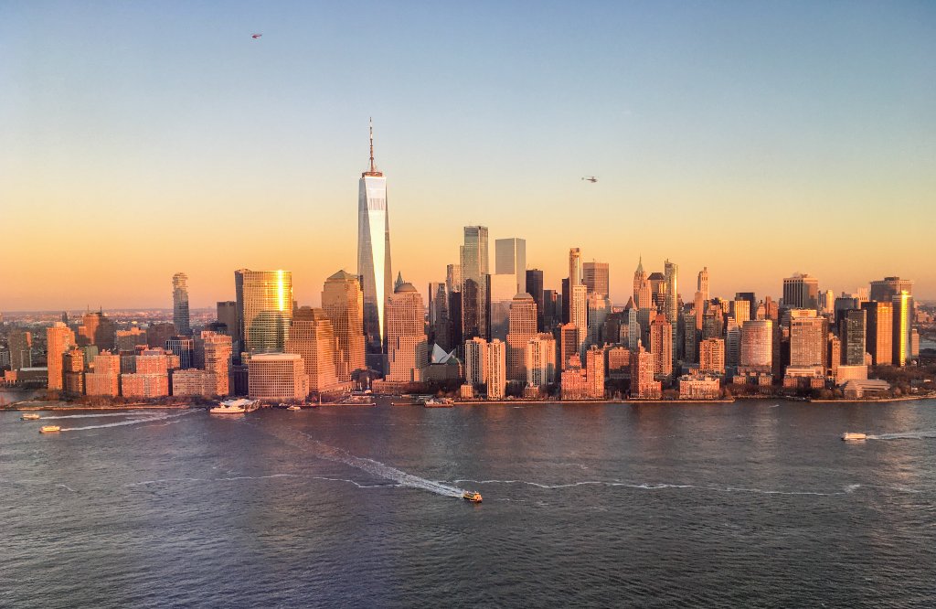 Misty golden hour view of the East River and Manhattan skyline
