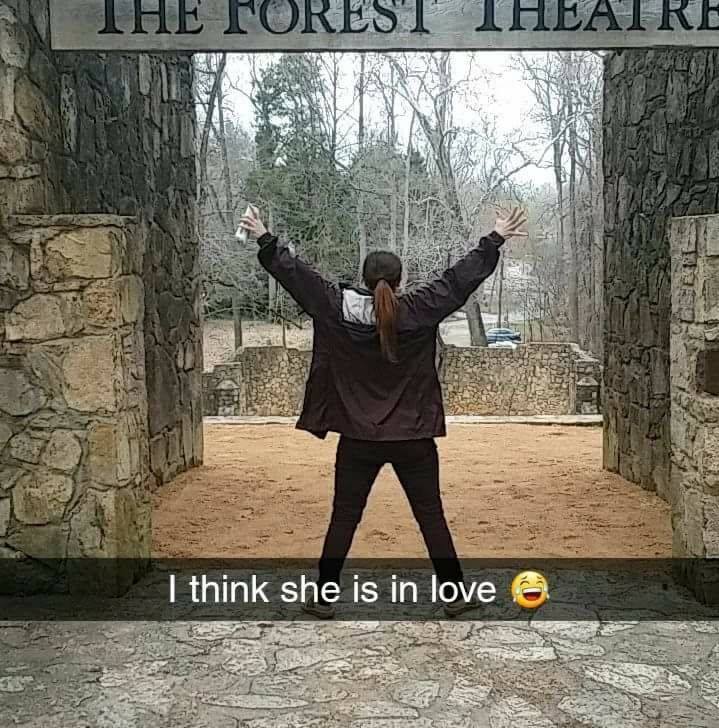 Debbie at the Forest Theatre, arms raised