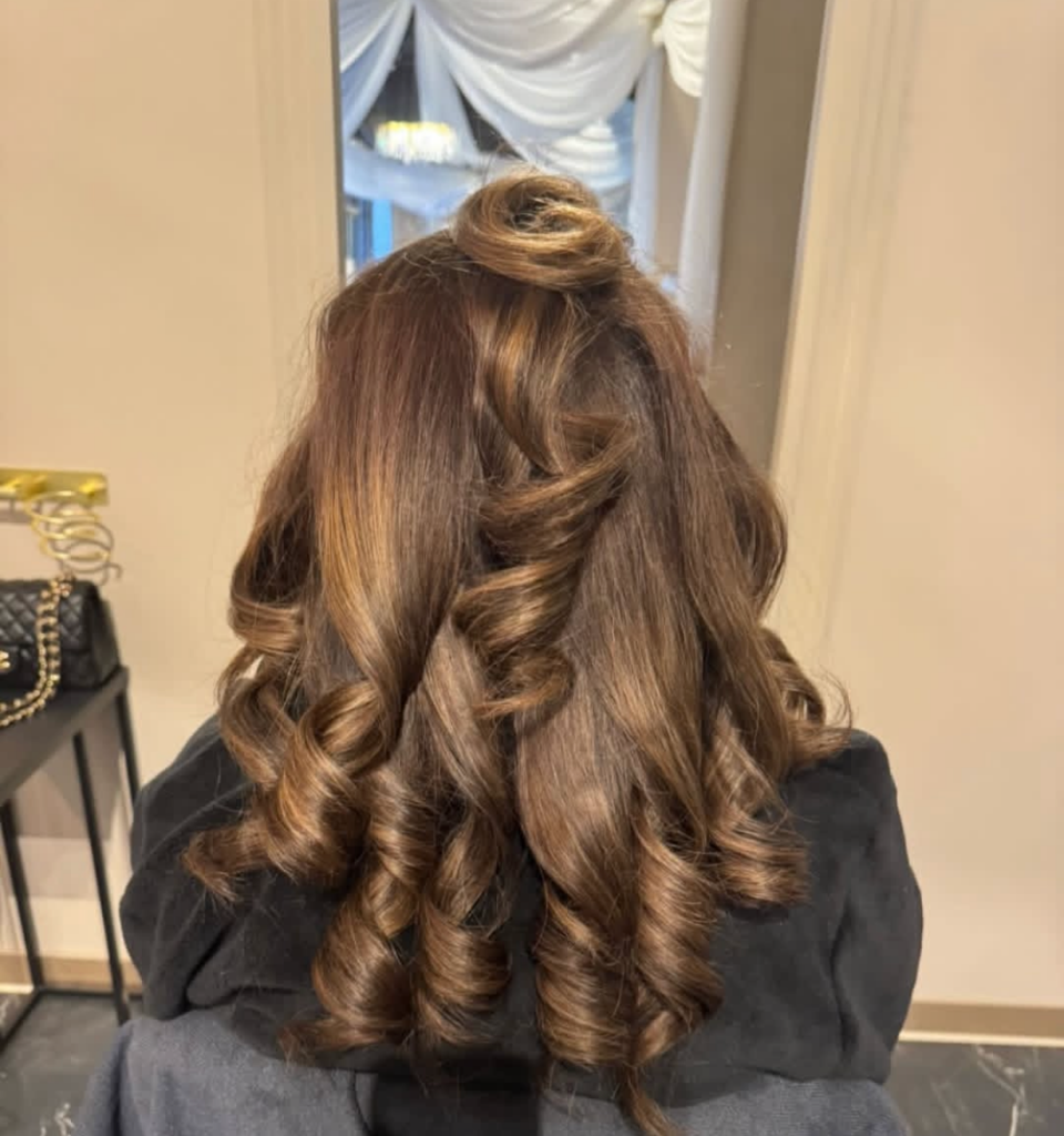 Bouncy blow dry with partial up-do