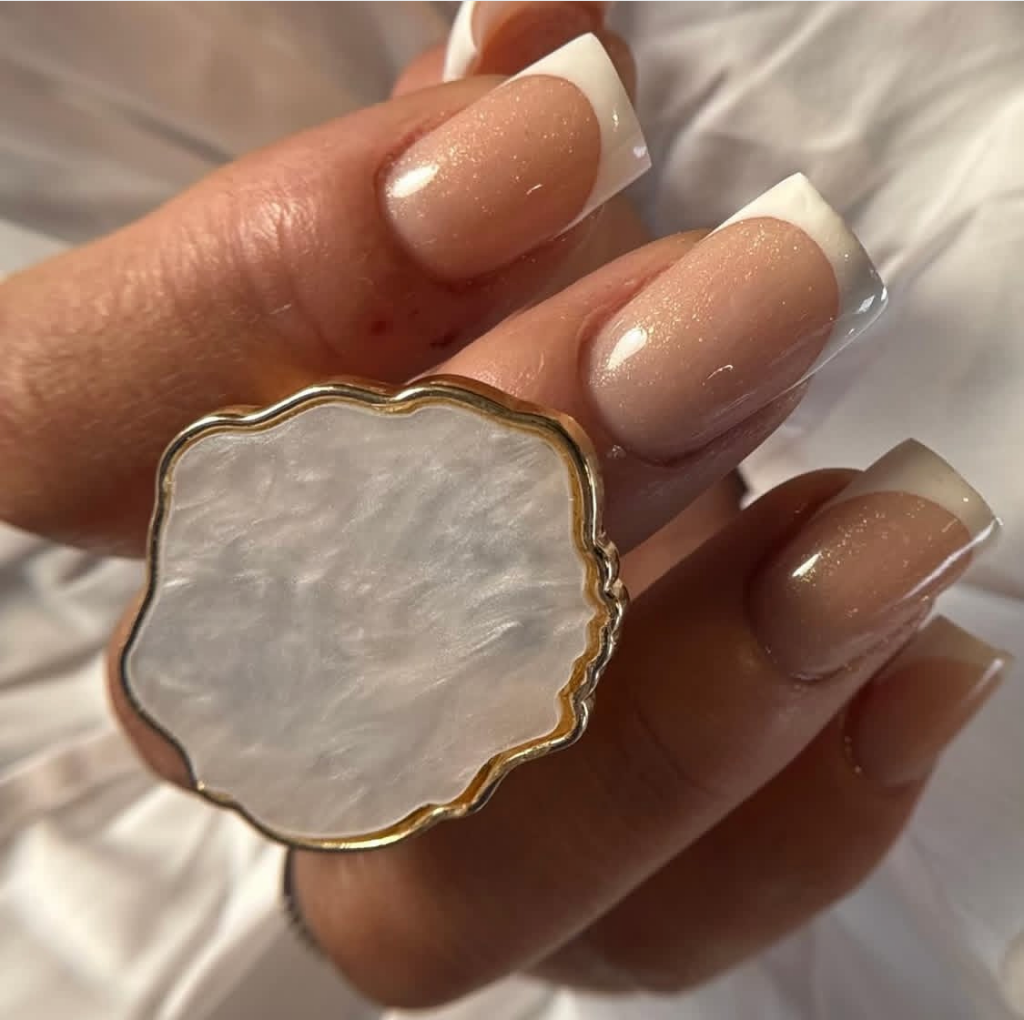 French manicure with statement ring