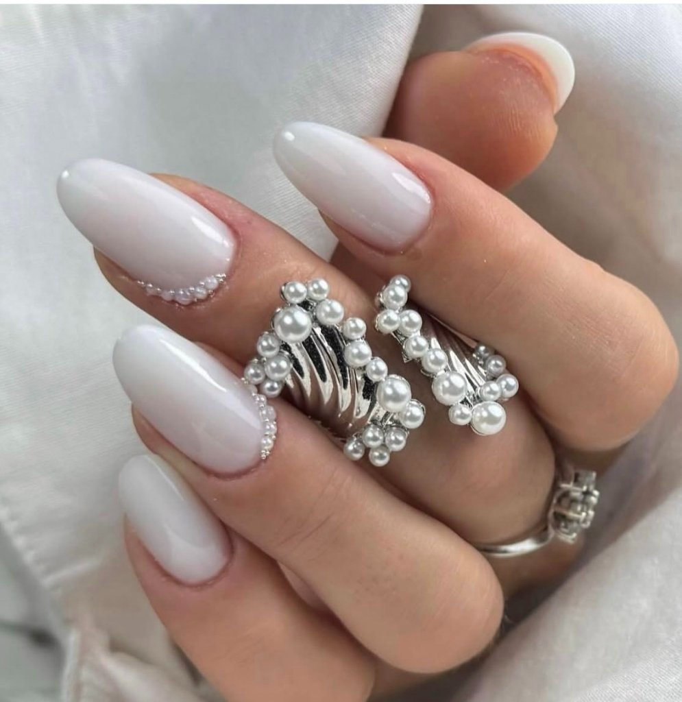 Milky white nails with pearl studs
