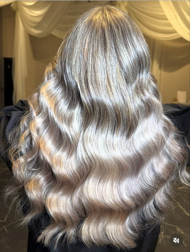 Ash-blonde balayage waves from behind