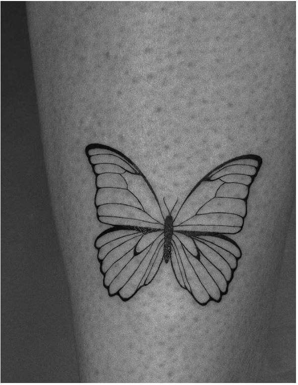 Fine line butterfly tattoo with stipple shading