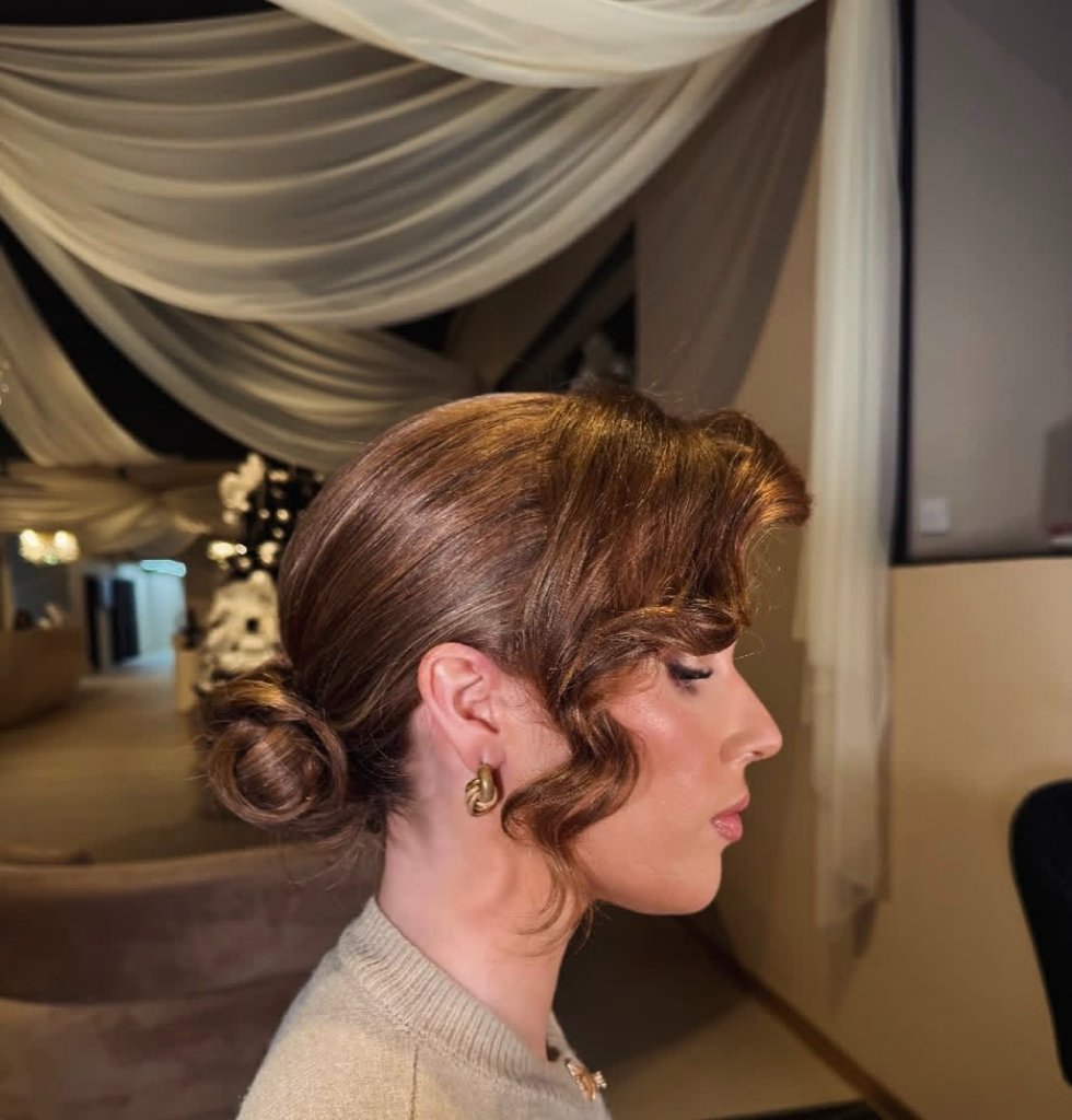 Elegant auburn hair updo — profile view
