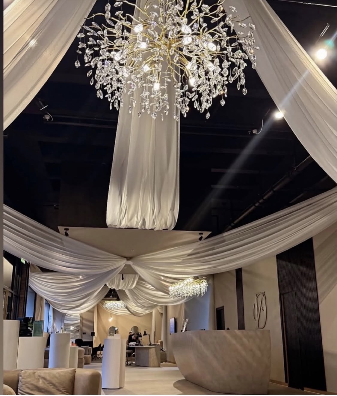 Event space with draped ceiling and crystal chandeliers