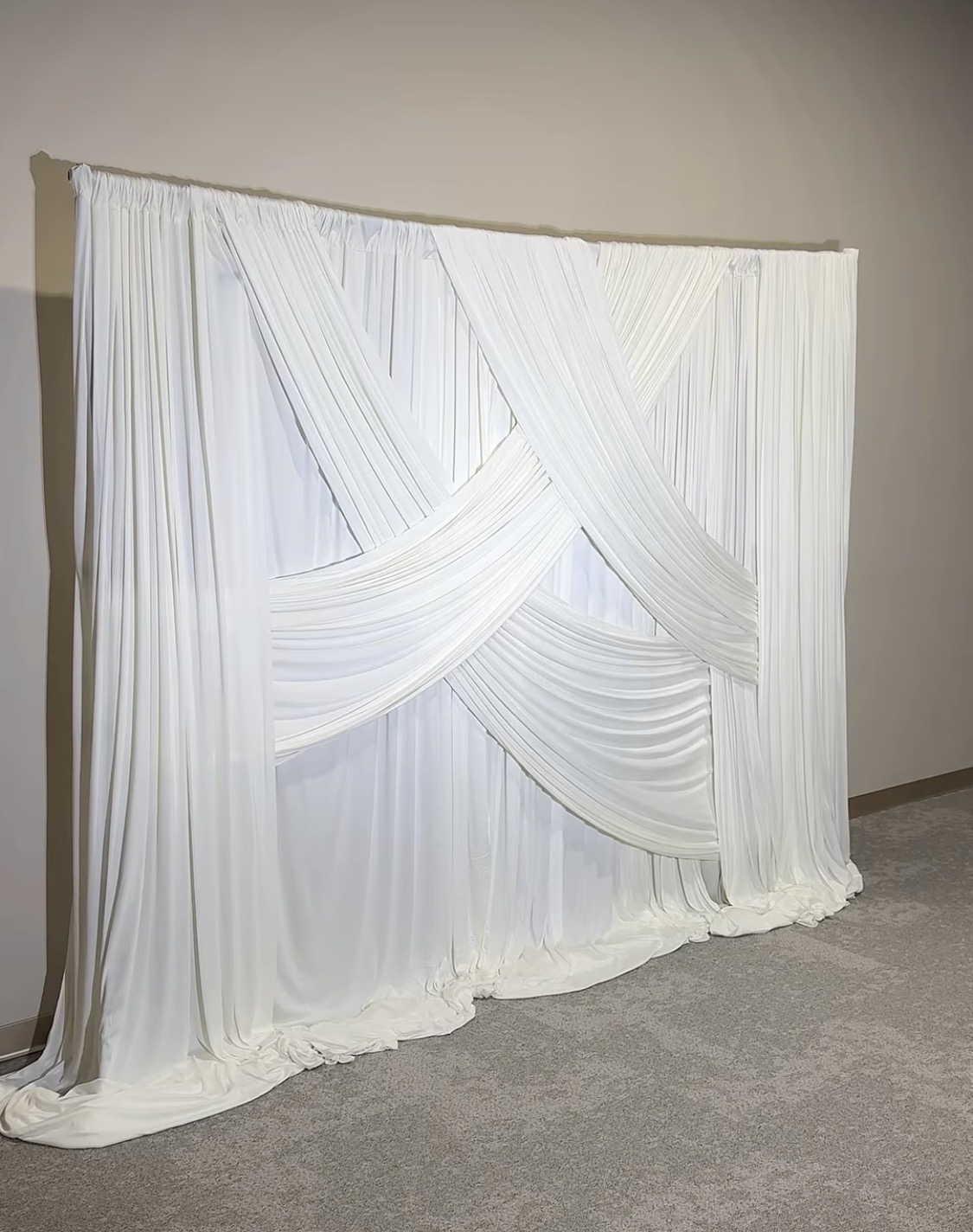 White pleated photo backdrop for event memories