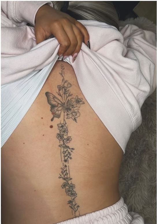 Butterfly and floral stem spine tattoo