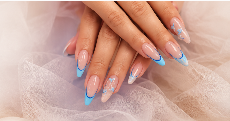 French manicure with light blue tips and delicate floral nail art accents