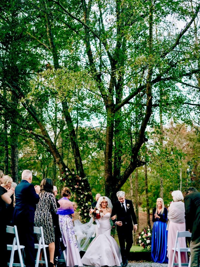 Bride and groom walking down the aisle