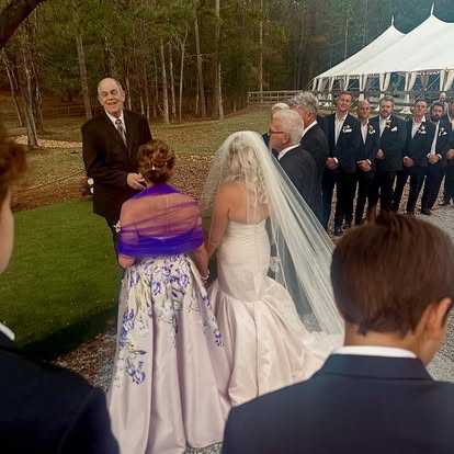 Bride and groom dance in barn
