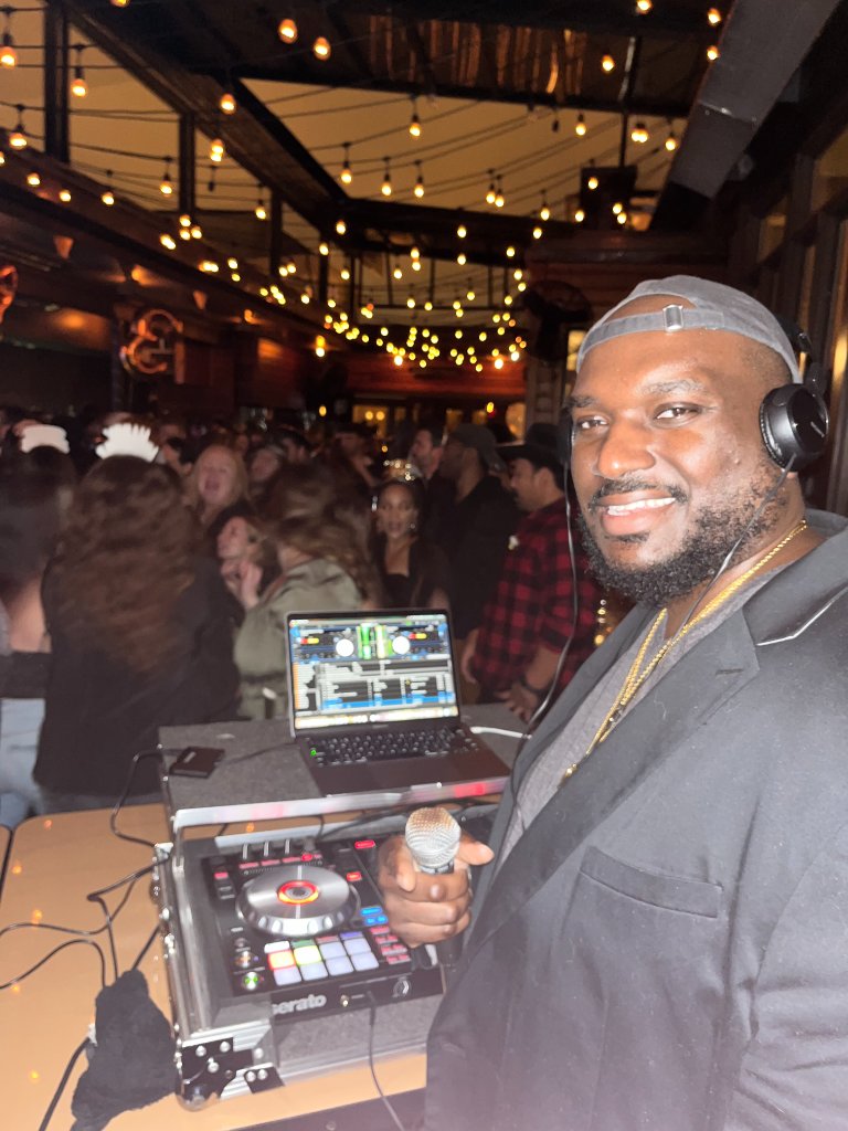 DJ Boss Player performing at a live event