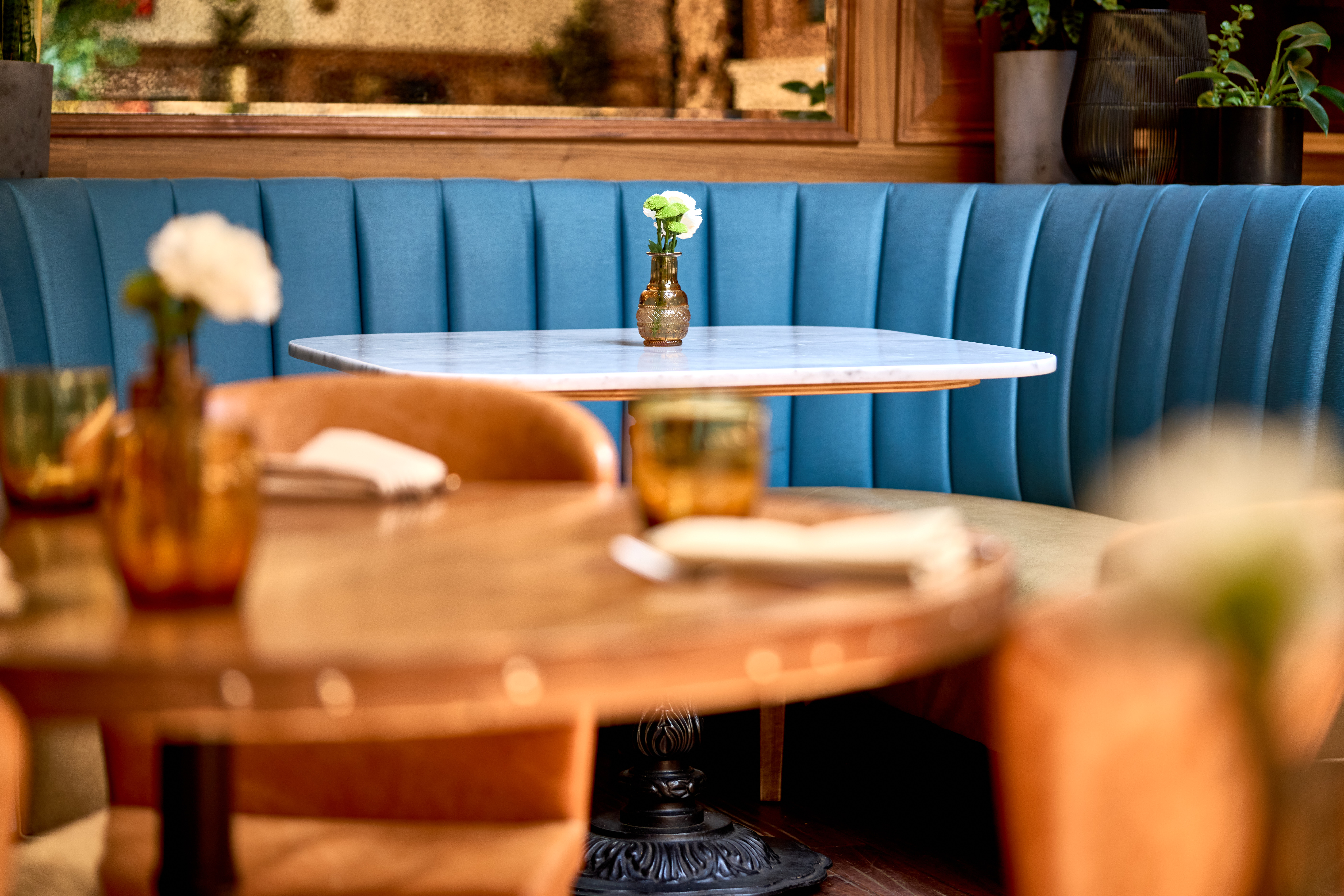 Tufted banquette seating for an intimate wedding celebration at Society Cafe