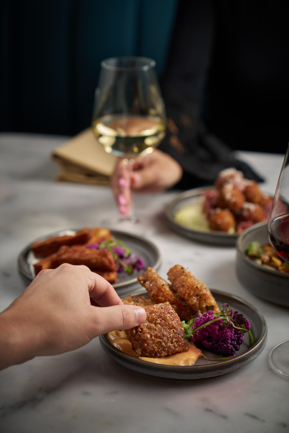 Shared plates and wine at a Society Cafe event in Greenwich Village